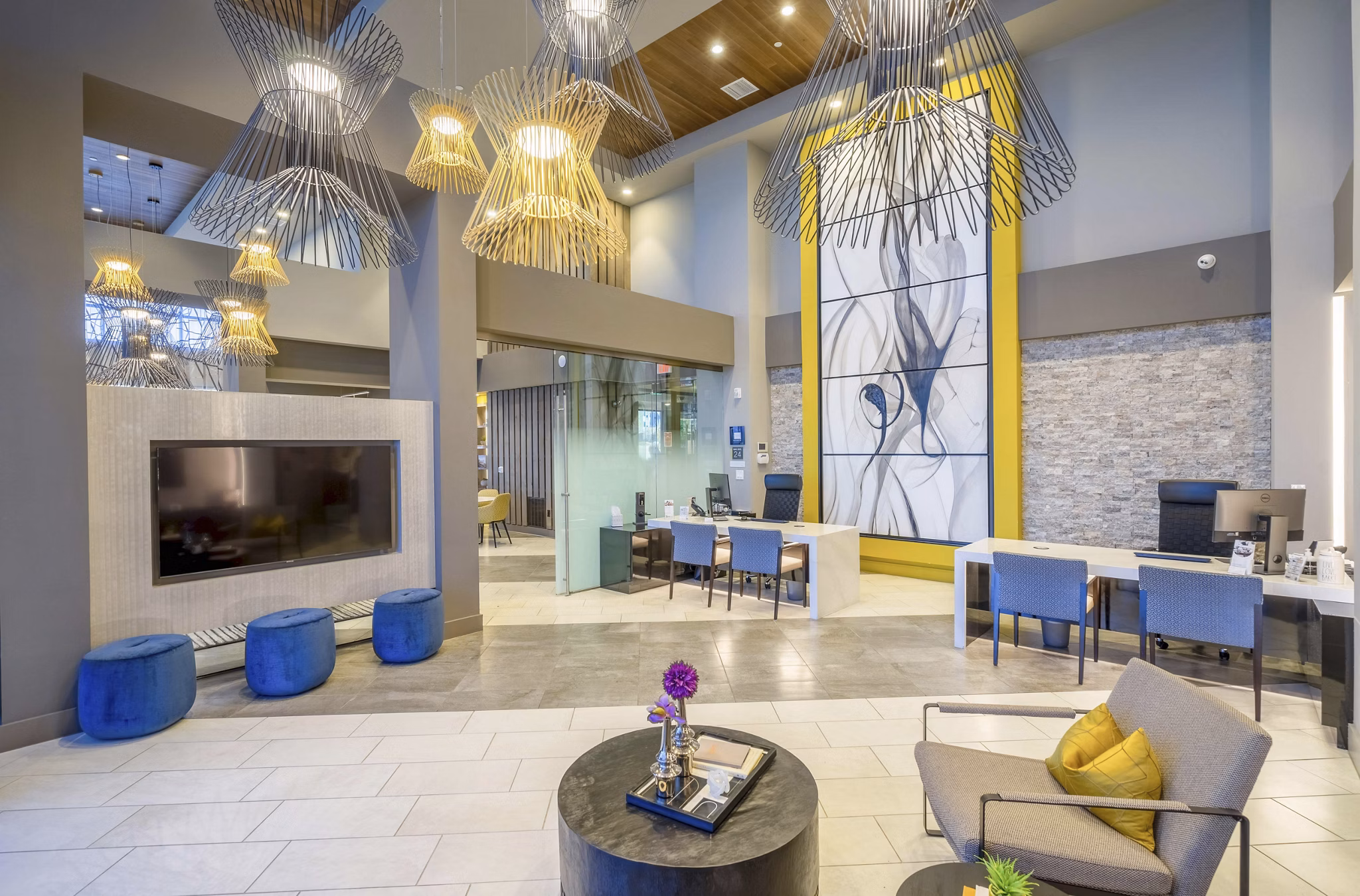 Modern clubhouse featuring elegant lounge and bar area at Cadence at Frisco Station Apartments, ideal for social gatherings and relaxation