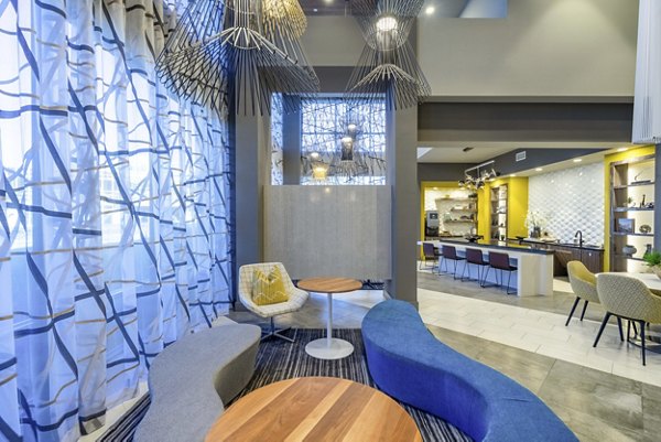 Comfortable lounge seating in clubhouse at Cadence at Frisco Station Apartments