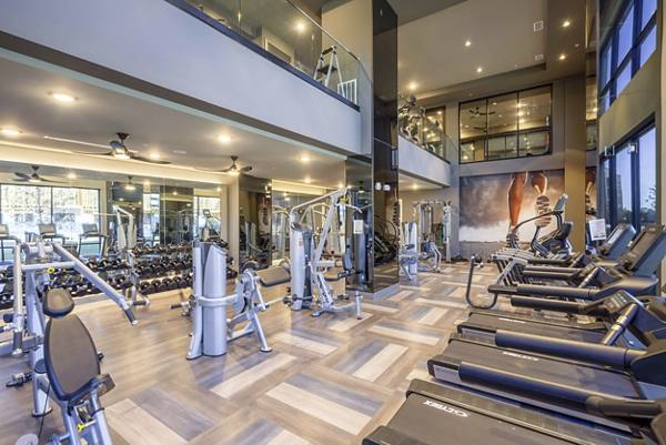 fitness center at Cadence at Frisco Station Apartments