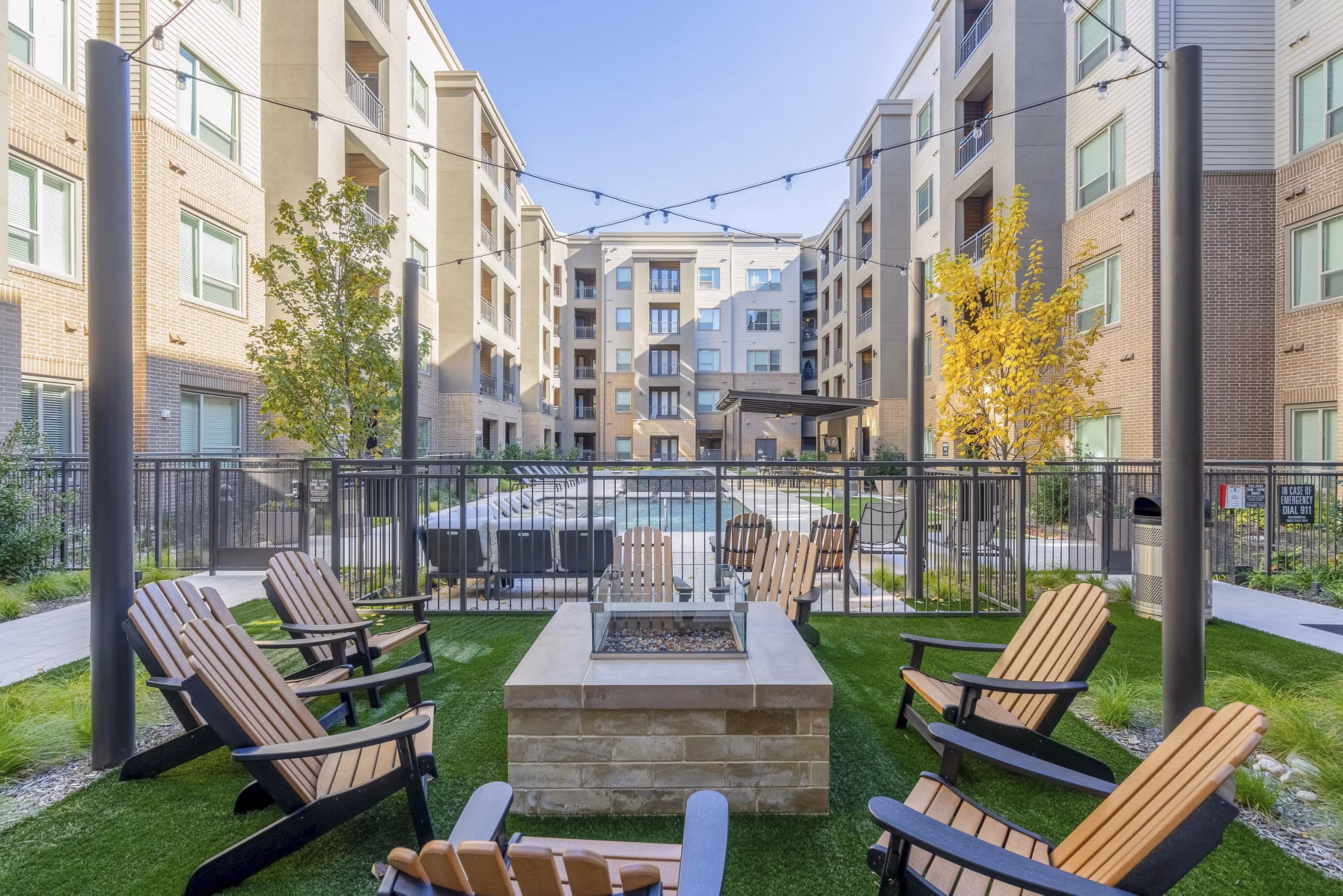 Cozy outdoor fire pit area at Cadence at Frisco Station Apartments