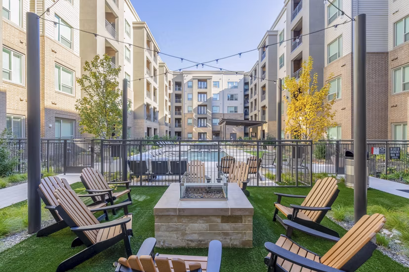 Cozy outdoor fire pit area at Cadence at Frisco Station Apartments