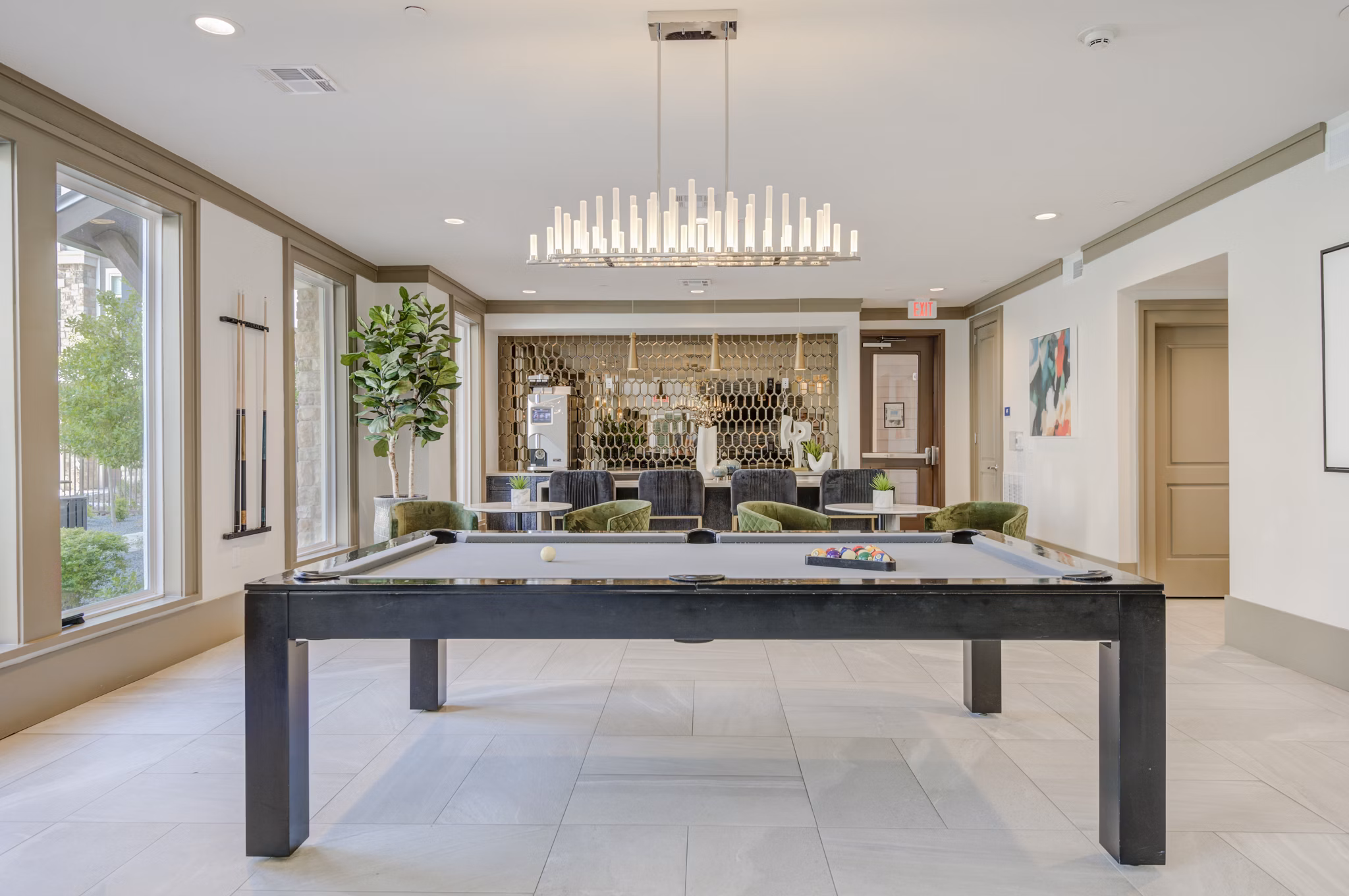 Vibrant game room with billiards and arcade games at The Link at Twin Creeks Apartments