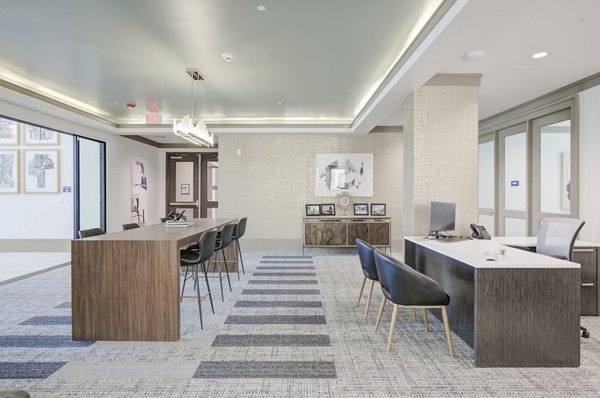 Chic clubhouse with modern furnishings at The Link at Twin Creeks Apartments â€“ ideal for resident gatherings and recreation