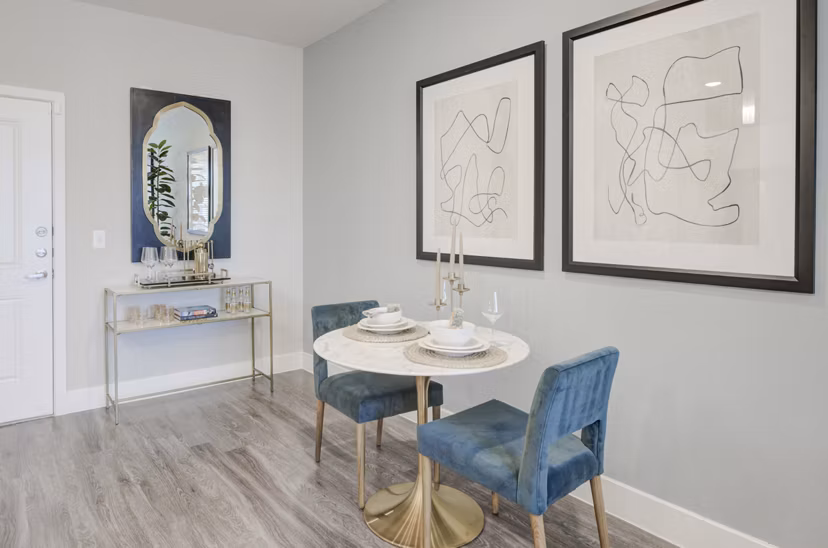 Dining area with modern furnishings and elegant decor at The Link at Twin Creeks Apartments