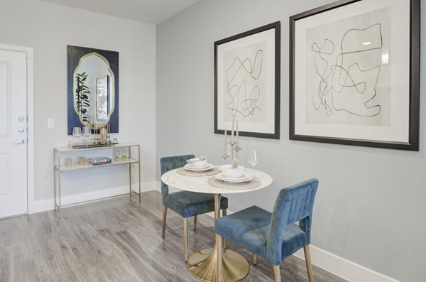 Dining area with modern furnishings and elegant decor at The Link at Twin Creeks Apartments