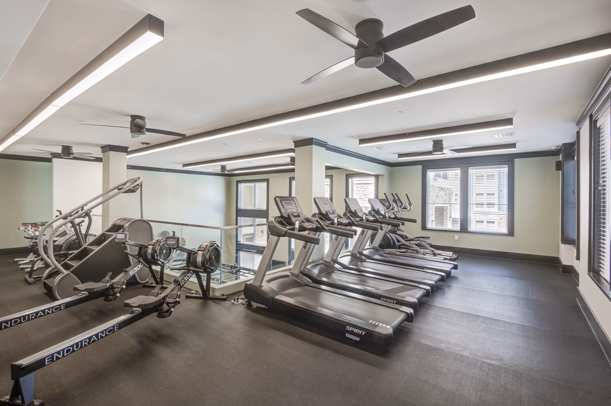 State-of-the-art fitness center with modern equipment at The Link at Twin Creeks Apartments Stay active and fit in a luxury setting