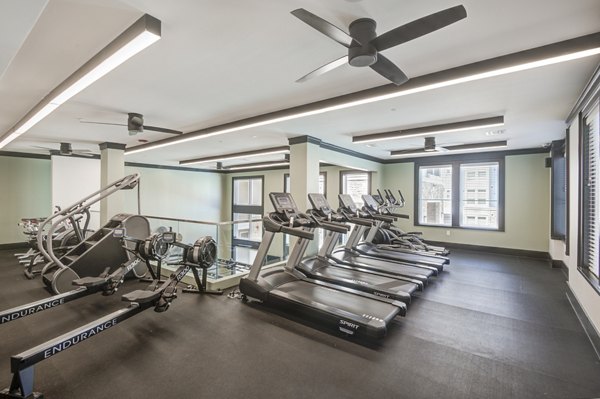 State-of-the-art fitness center with modern equipment at The Link at Twin Creeks Apartments Stay active and fit in a luxury setting