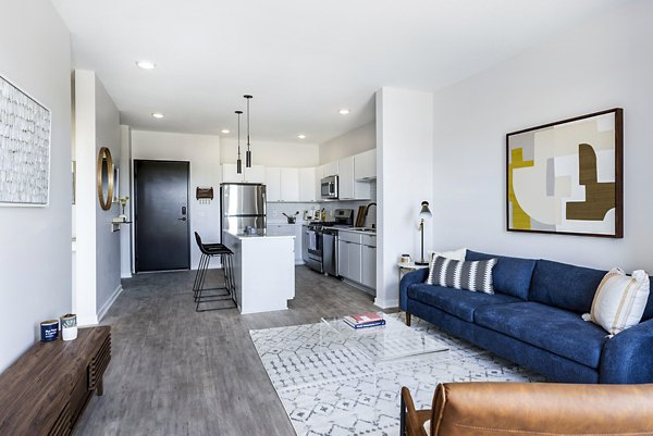 Spacious living room with modern decor in Beyond Woodbury Apartments