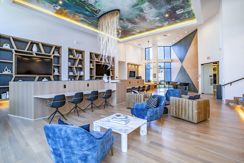 Clubhouse lobby with modern decor at The Accolade Collegiate Village West Apartments