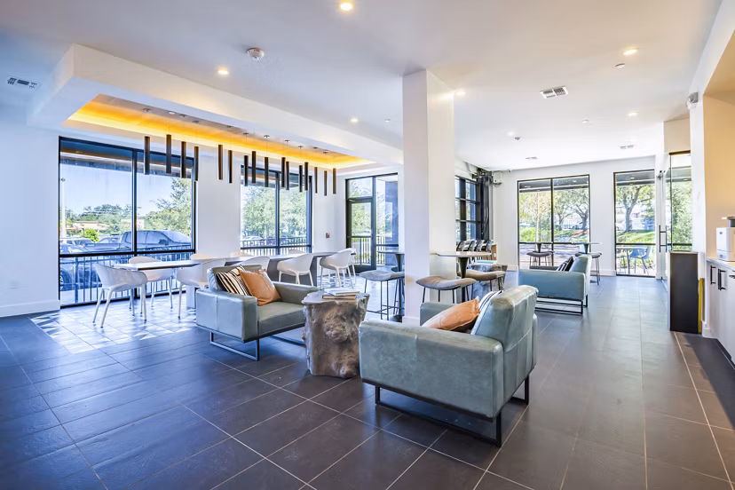 Clubhouse lobby with modern furnishings at The Accolade Collegiate Village West Apartments