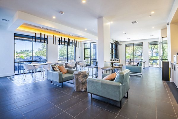 Clubhouse lobby with modern furnishings at The Accolade Collegiate Village West Apartments