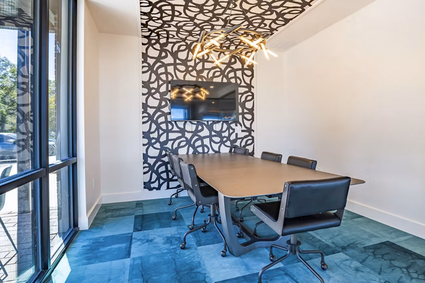 Modern clubhouse meeting facility at The Accolade Collegiate Village West Apartments, designed to facilitate gatherings and collaborative events