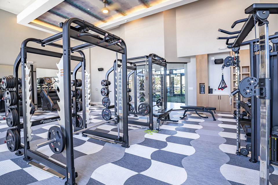 Fitness center with top-notch equipment at The Accolade Collegiate Village West Apartments