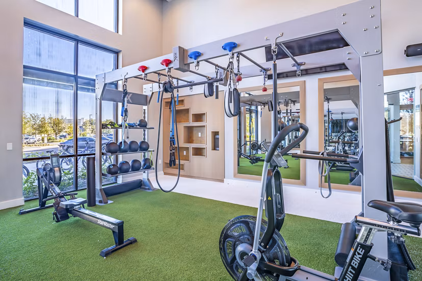 Modern fitness center with state-of-the-art equipment at The Accolade Collegiate Village West Apartments