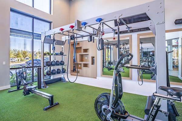 fitness center at The Accolade Collegiate Village West Apartments