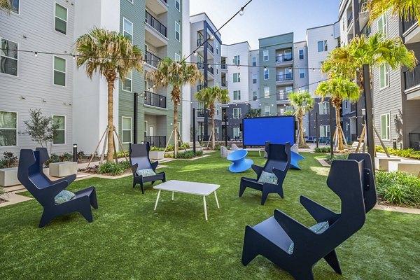 Spacious patio with modern seating at The Accolade Collegiate Village West Apartments