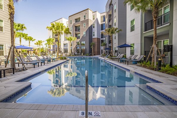 Resort-style pool at The Accolade Collegiate Village West Apartments, offering a luxurious outdoor retreat for residents