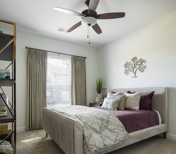 Bedroom featuring modern design elements at Savannah West Apartments