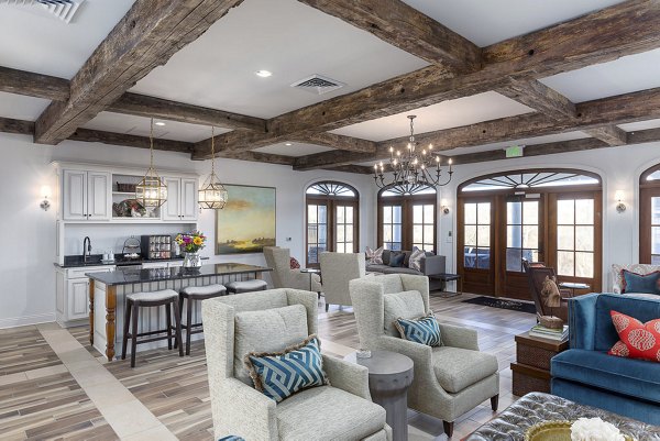 Modern clubhouse featuring social lounge and fireplace at Savannah West Apartments, a luxury apartment community