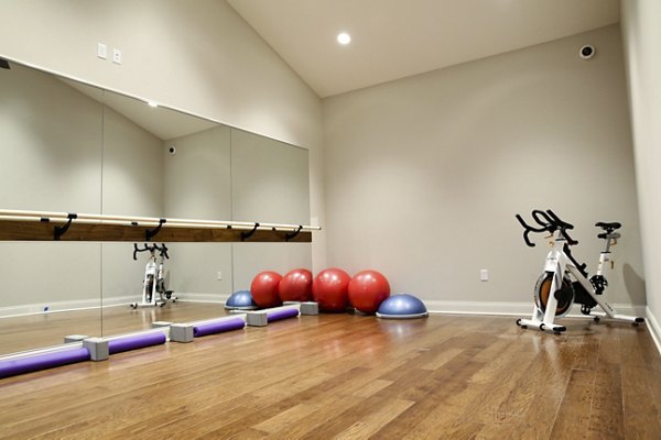 Yoga and spin studio featuring modern equipment at Savannah West Apartments