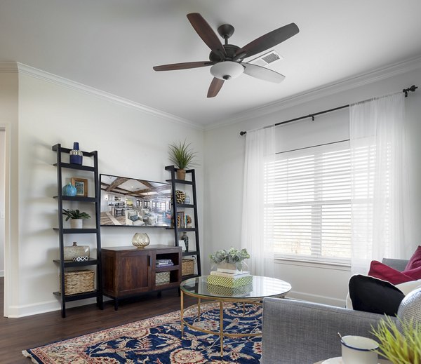 Spacious living room with modern decor in Savannah West Apartments, offering comfort and style in luxury urban living
