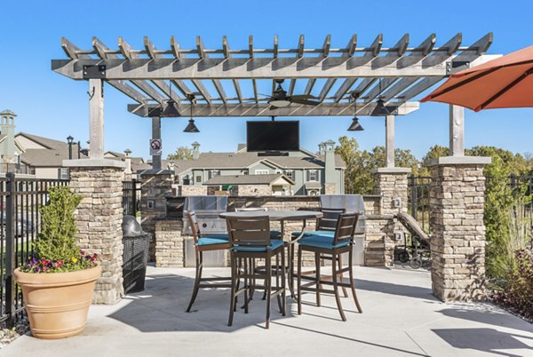 Outdoor grill area with modern seating at Savannah West Apartments, perfect for entertaining and relaxation in Greystar's luxury community