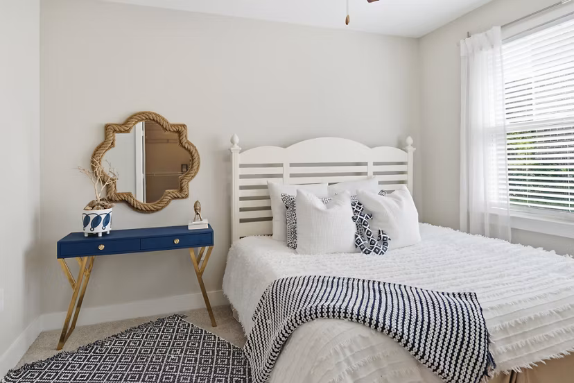The Arden Apartments: Cozy bedroom with modern decor and ample natural light