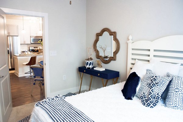 The Arden Apartments: Cozy bedroom with modern decor and ample natural light