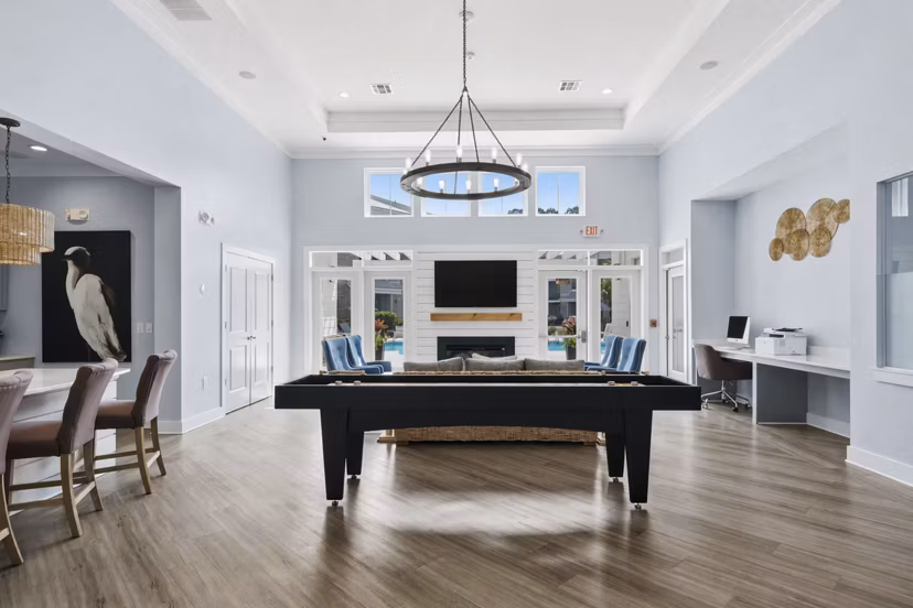 Clubhouse at The Arden Apartments: Modern community space with seating and games, luxury apartments by Greystar in Charlotte, NC