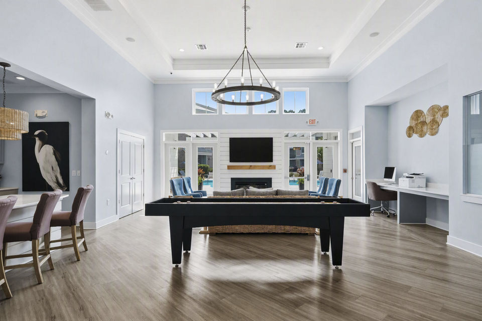 Clubhouse at The Arden Apartments: Modern community space with seating and games, luxury apartments by Greystar in Charlotte, NC