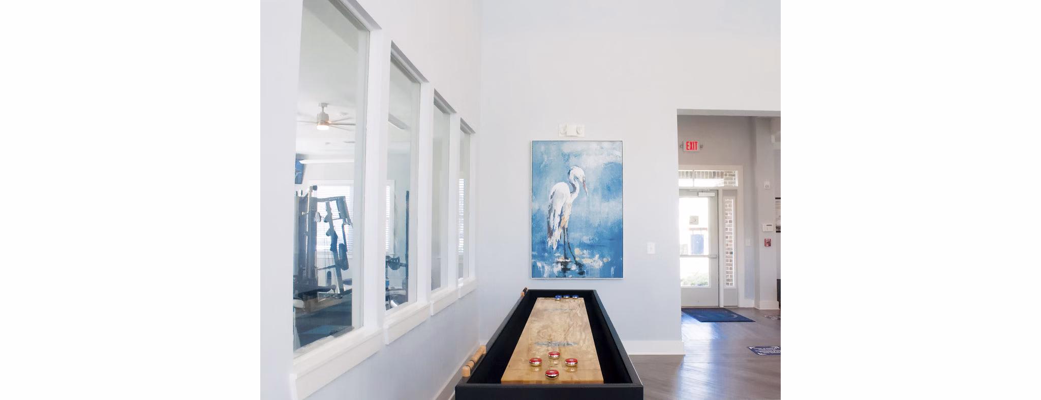 Clubhouse with modern dÃ©cor and seating options at The Arden Apartments, offering a luxurious community space for residents