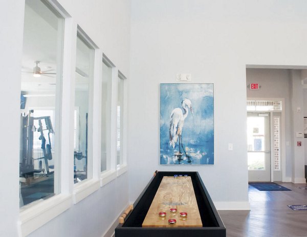 Clubhouse with modern dÃ©cor and seating options at The Arden Apartments, offering a luxurious community space for residents