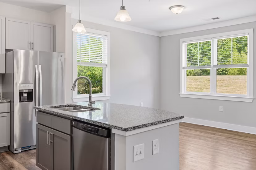 Dining area with modern decor and natural light at The Arden Apartments