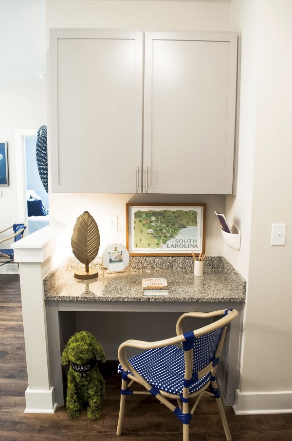 Home office with ergonomic desk and natural light in The Arden Apartments