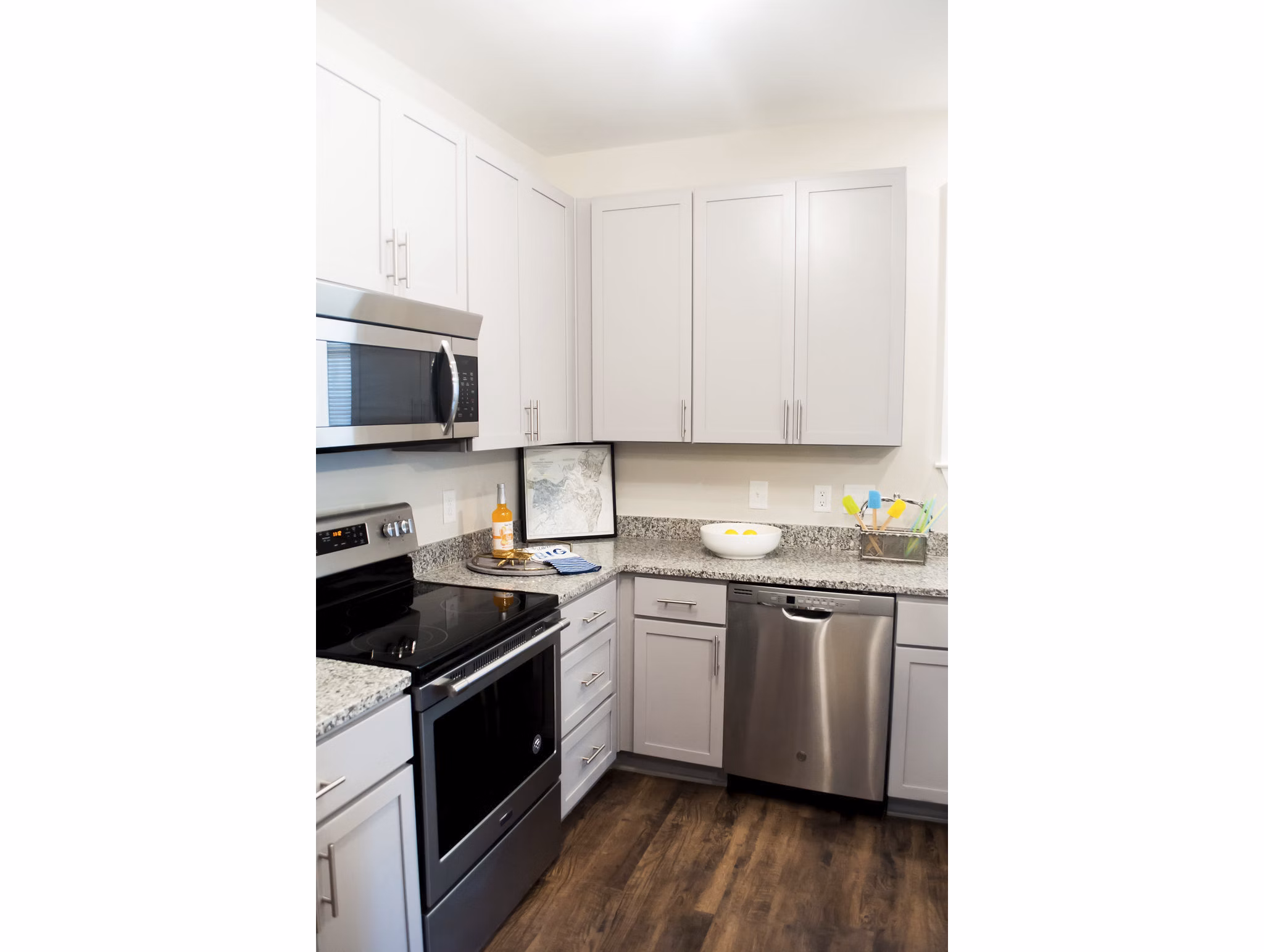 Modern kitchen with stainless steel appliances at The Arden Apartments, featuring sleek cabinetry and contemporary design elements