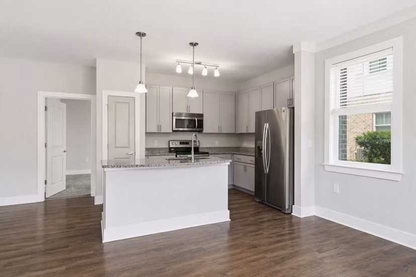 Modern kitchen with stainless steel appliances in The Arden Apartments, offering luxury living in a premier Greystar community