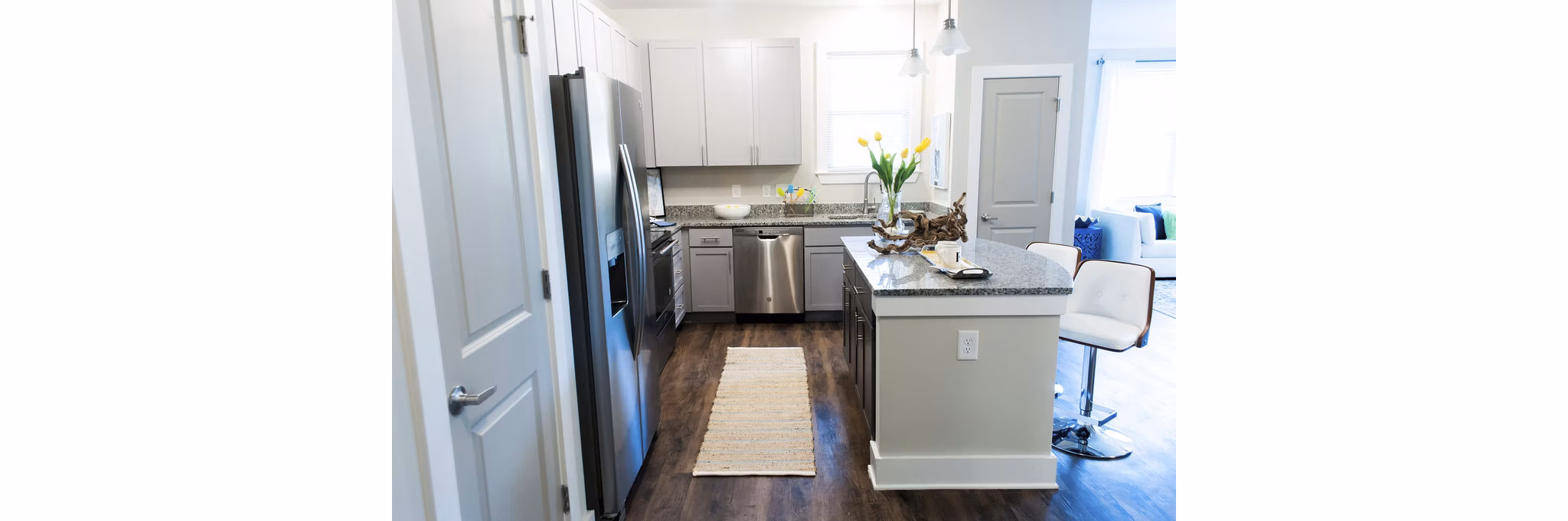 Modern kitchen with stainless steel appliances at The Arden Apartments, luxury living at its finest