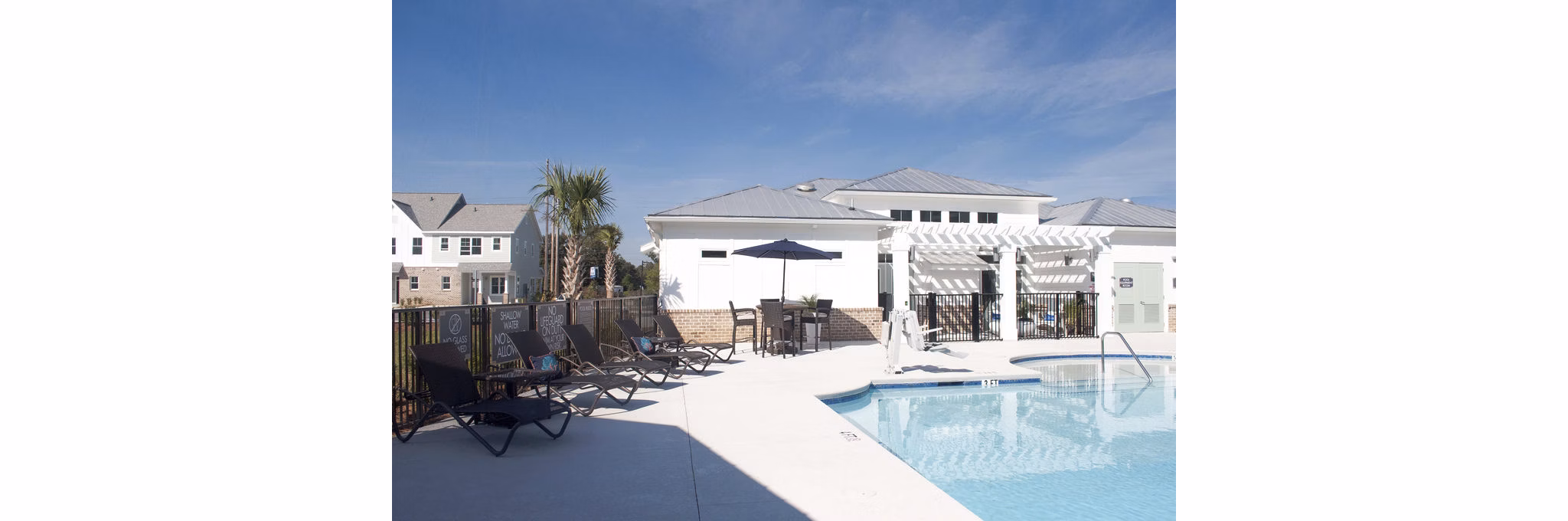 Luxurious outdoor pool at The Arden Apartments elevated among lush greenery