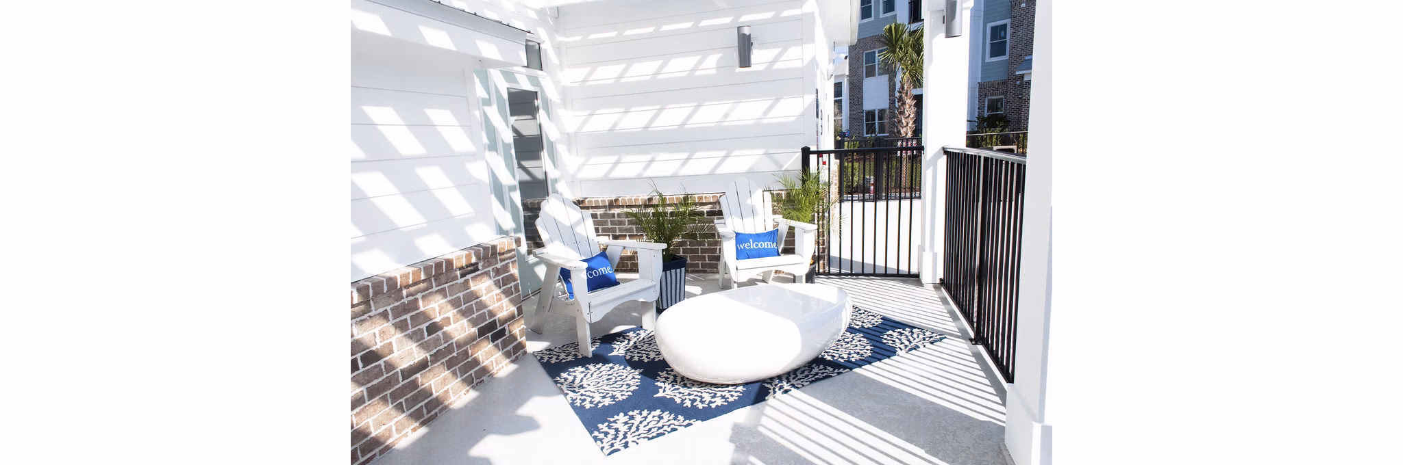 Community pool surrounded by luxury loungers at The Arden Apartments