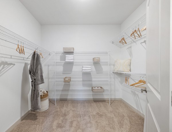Modern closet with built-in shelving in a bedroom at Album Huntersville Apartments, ideal for organized living