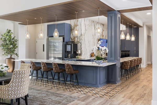 Stylish clubhouse featuring modern design at Album Huntersville Apartments, ideal for leisure and social gatherings