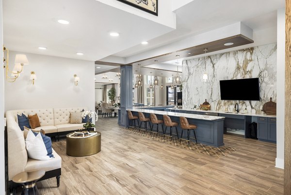 Modern clubhouse with chic furniture at Album Huntersville Apartments offering luxury amenities for residents