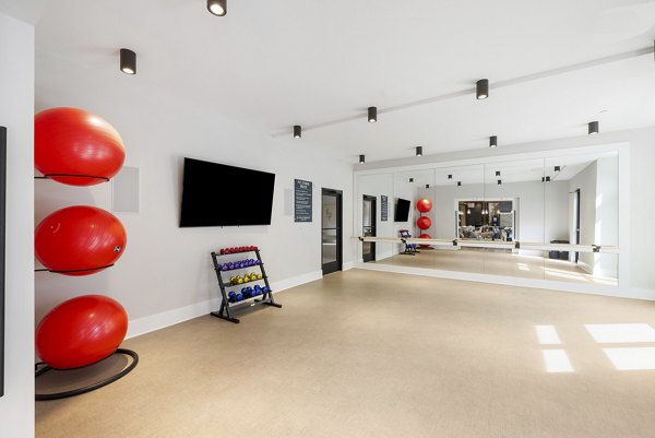 Modern fitness center with state-of-the-art equipment at Album Huntersville Apartments, perfect for active lifestyles seeking luxury living