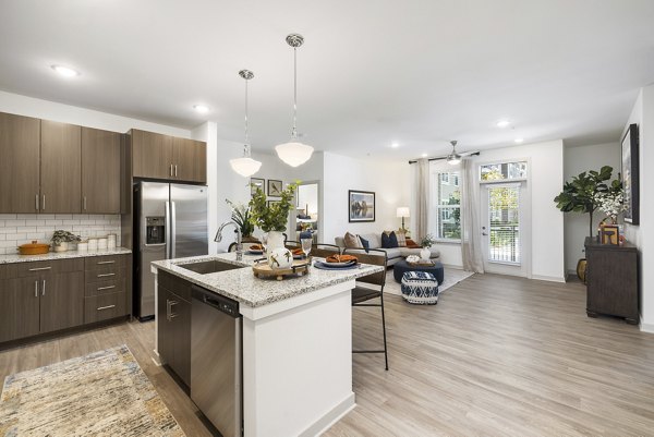 Elegant kitchen with stainless steel appliances in Album Huntersville Apartments