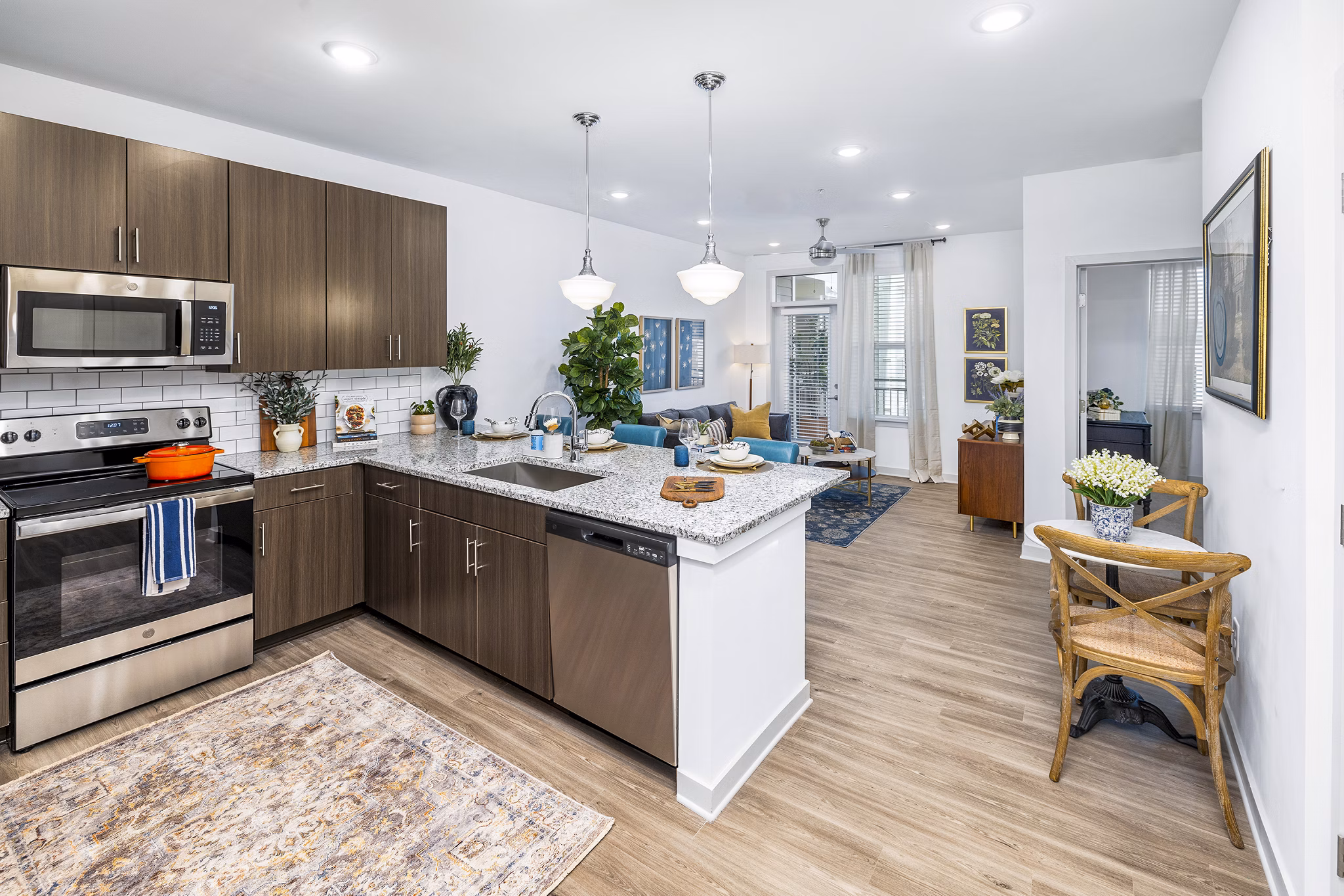 Modern kitchen with stainless steel appliances at Album Huntersville Apartments