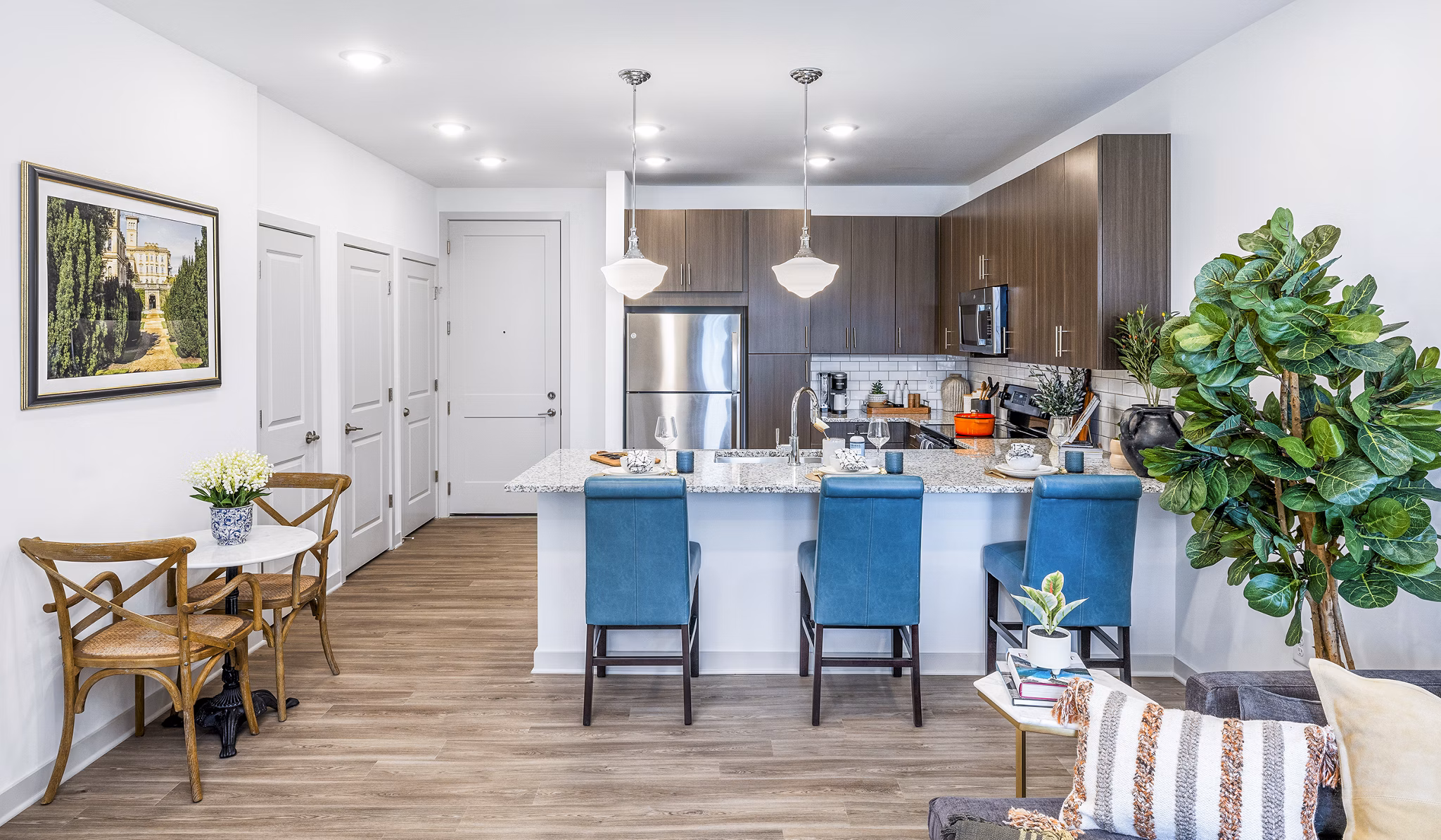 Modern kitchen with stainless steel appliances in Album Huntersville Apartments for luxurious living
