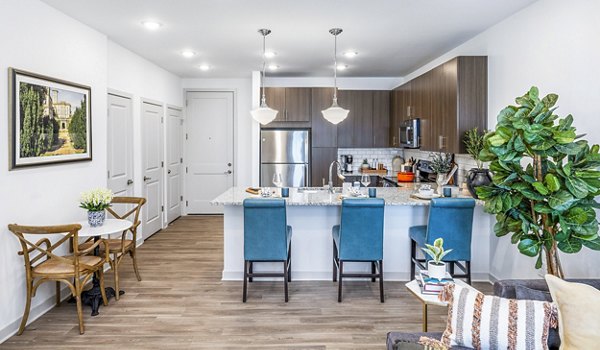 Modern kitchen with stainless steel appliances in Album Huntersville Apartments for luxurious living