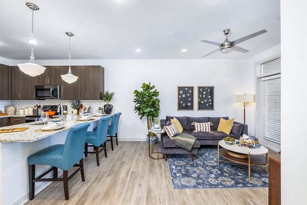 Spacious living room with modern decor in Album Huntersville Apartments, Greystar luxury apartments in Huntersville
