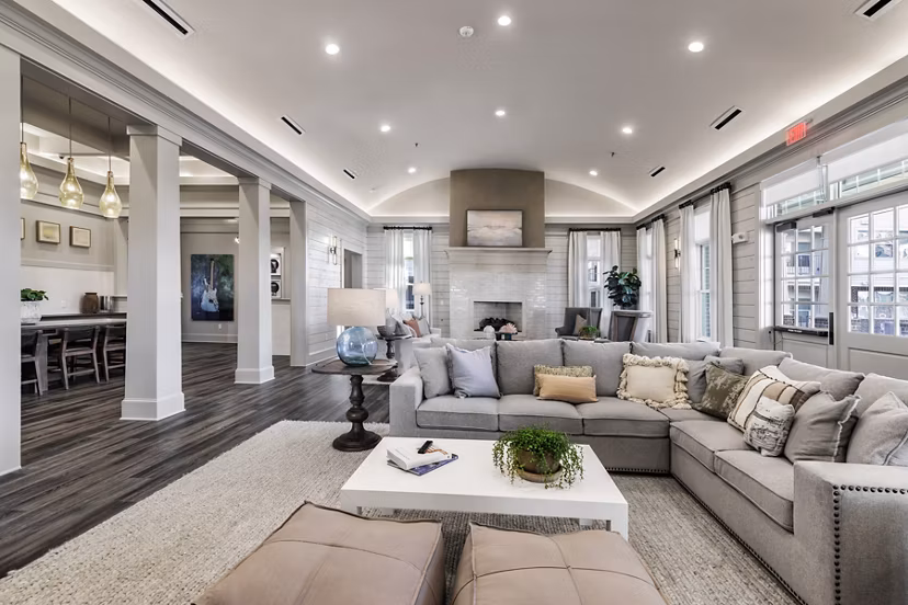 The Vaughan Apartments: Stylish clubhouse featuring lounge seating and billiards in a luxury property by Greystar