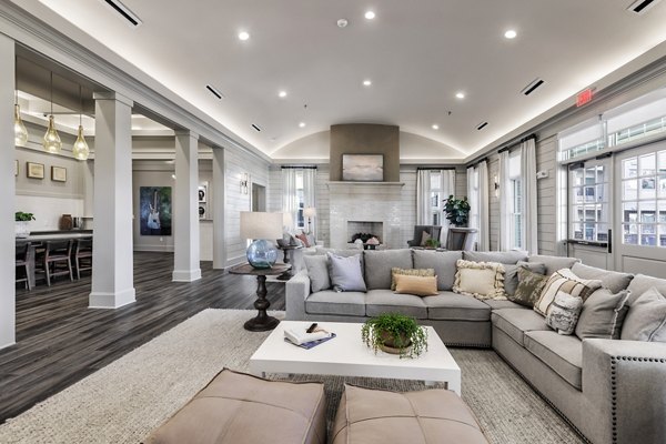 The Vaughan Apartments: Stylish clubhouse featuring lounge seating and billiards in a luxury property by Greystar